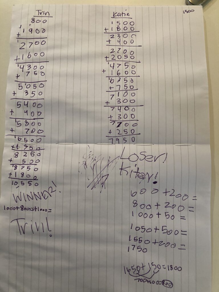 Score sheet using lined paper to keep numbers aligned based on place value.